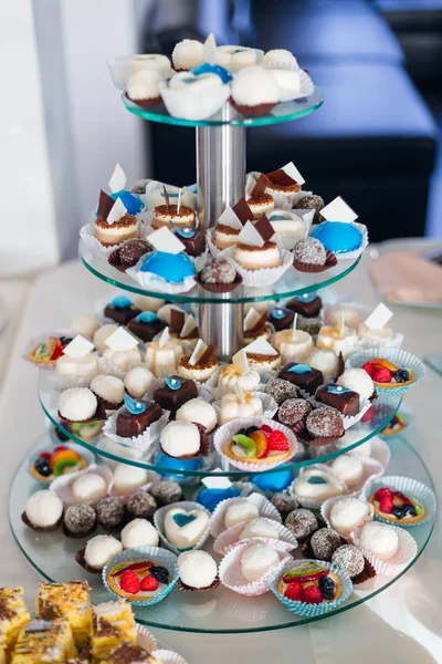 Multilevel stand with various sweets. candy bar at wedding recep — 스톡 사진