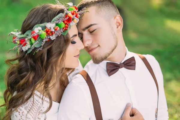 Girl in a wreath hugged the guy from back side and they closed t — Stok fotoğraf