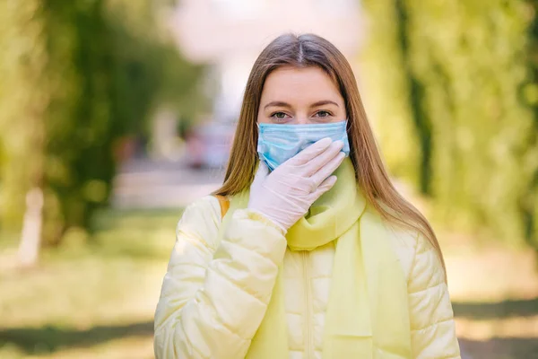 woman wearing face mask during corona virus and flu outbreak. Disease and illness protection. Surgical masks for coronavirus prevention. Sick patient coughing