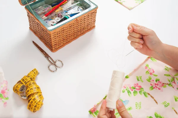 Hands of young woman sewing — Stock Photo, Image