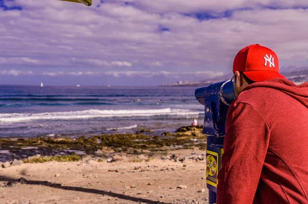 Boy Watching The Union Of The Sea With The Sky On Las Americas Beach. April 11, 2019. Santa Cruz De Tenerife Spain Africa. Travel Tourism Street Photography.