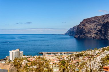Magnificent views of The Gigants cliffs and the Port of Santiago from the Achipenque Lookout. April 13, 2019. Santiago Port, Santa Cruz De Tenerife Spain Africa. Travel Tourism Street Photography.