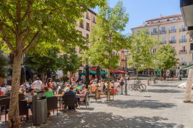 Castiza Chueca Square with its terraces of bars and shops cradle of gay pride in Madrid. June 15, 2019. Madrid. Spain. Travel Tourism Holidays clipart