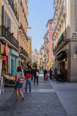 People Strolling Through The Chueca Square And Buying In Their Stores The Cradle Of Gay Pride In Madrid. June 15, 2019. Madrid. Spain. Travel Tourism Holidays clipart