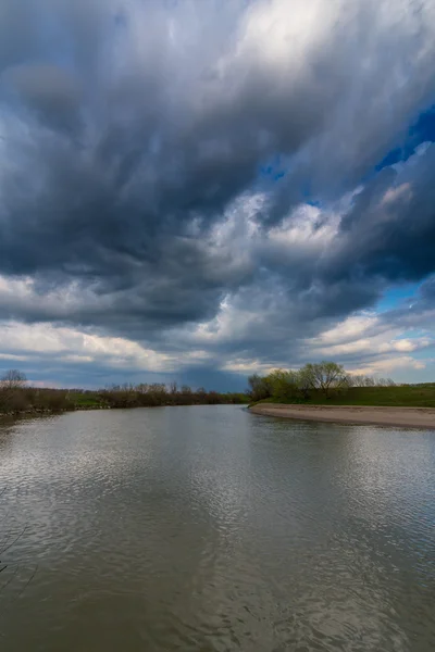 Ominous stormy sky over natural lake — Stock Photo, Image