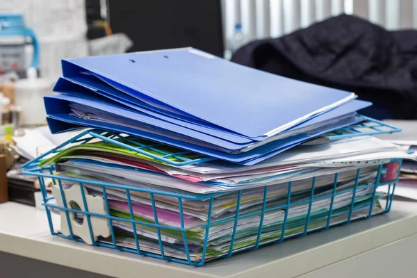 file folder and Stack of business report paper file on the table in a work office.