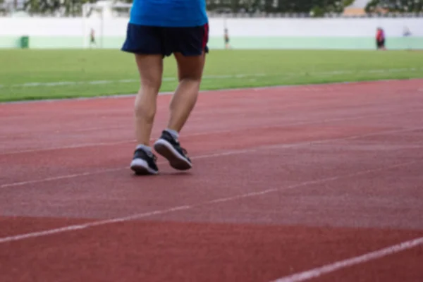 Rozmazané Červená Běžecká Stopa Stadion Zázemí Sportovců Cvičí Pro Fitness — Stock fotografie