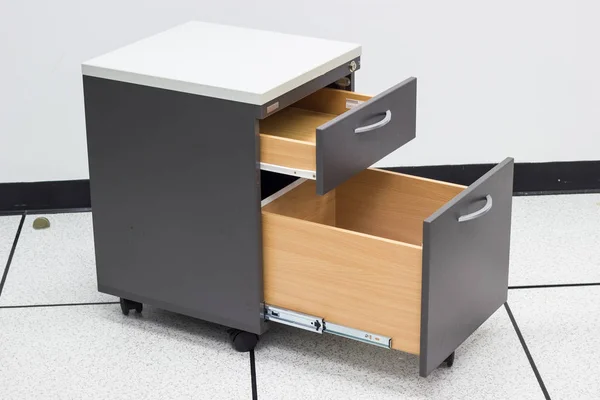 file cabinet with open drawer in the office.