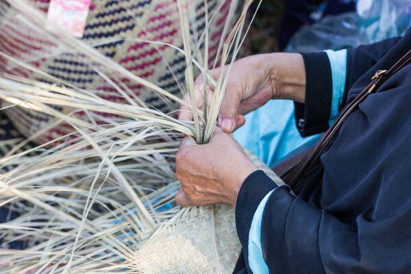 The villagers took bamboo stripes to weave into different forms for daily use utensils of the communitys people in Bangkok Thailand, Thai handmade product.  