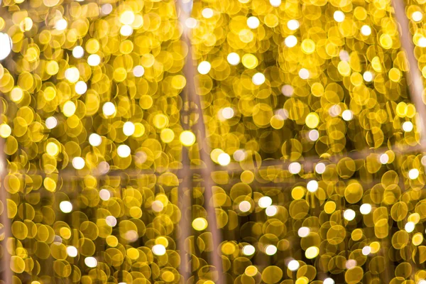 Blur - bokeh Decorative outdoor string lights hanging on tree in the garden at night time - decorative christmas lights - happy new year