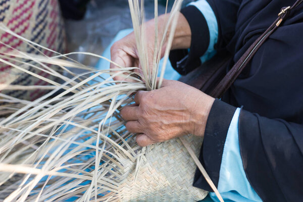 The villagers took bamboo stripes to weave into different forms for daily use utensils of the communitys people in Bangkok Thailand, Thai handmade product.  