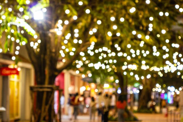 Blur - bokeh - Decorative outdoor string lights hanging on tree