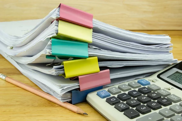 file folder and Stack of business report paper file with Calculator on the table in a work office, concept document in work office