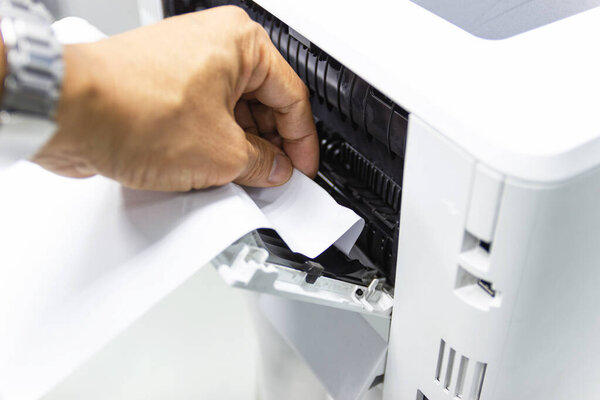 Technicians Removing Paper Stuck, Paper Jam In Printer At Office