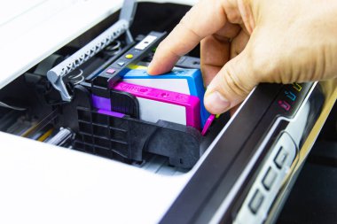 Technicians are install setup the ink cartridge of a inkjet printer the device of office automate for printing clipart