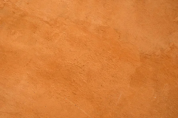 Çimento turuncu arka planda boyanır . — Stok fotoğraf