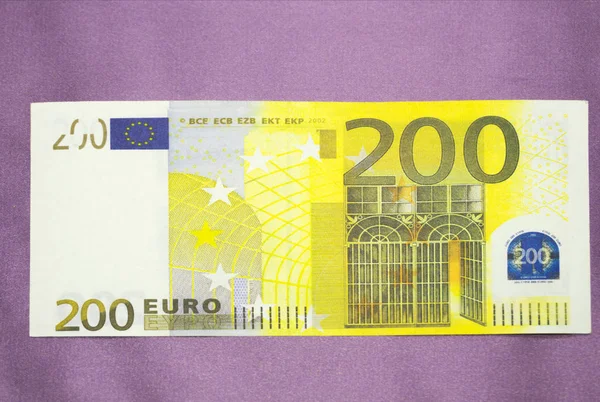 Zbliżenie zdjęcie części Uwaga dwustu euro. Fotografia makro. — Zdjęcie stockowe