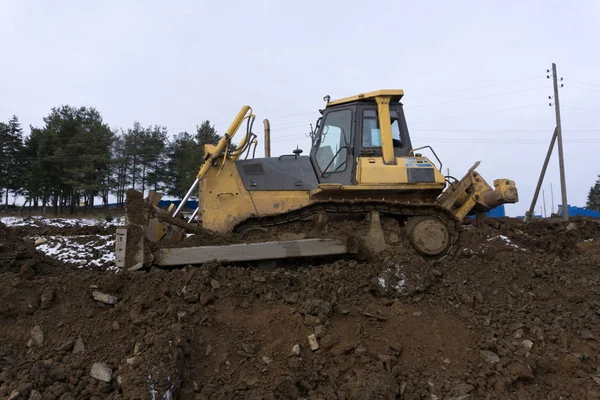 An excavator working removing earth on a construction site