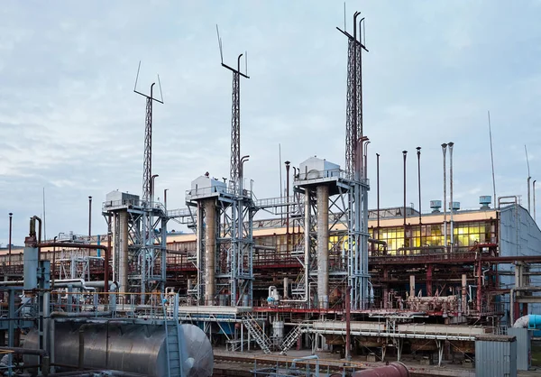 At modern chemical plant. Air cooling system with electric motors and synthesis columns of chemical production.