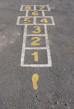 A hopscotch game court painted on bitumen clipart