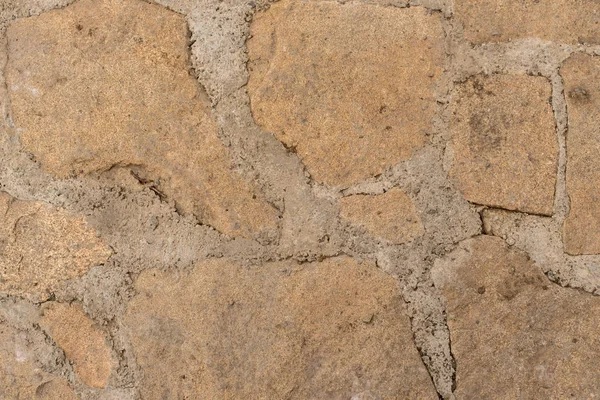 arka plan düz olmayan parça taş döşeli