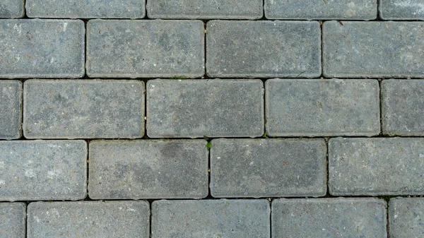 La consistenza delle piastrelle del pavimento di cemento. Superficie ruvida con particelle di sabbia e detriti . — Foto Stock