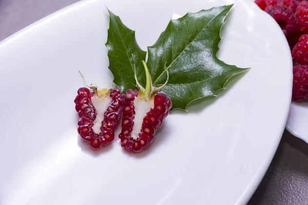 Raspberries cut in half — Stock Photo, Image