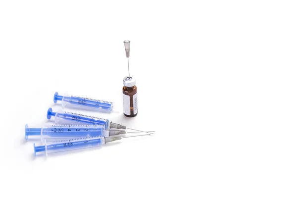 Four shots with needles ready to fill up — Stock Photo, Image