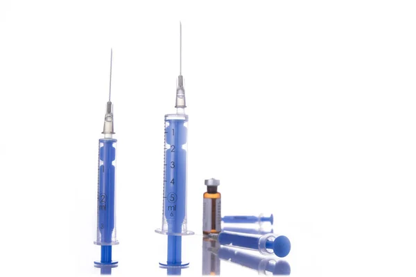 Two shots stand up and two injections laying — Stock Photo, Image