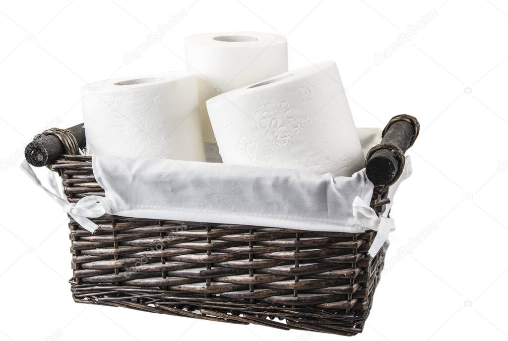 Basket full of toilet paper on the white background