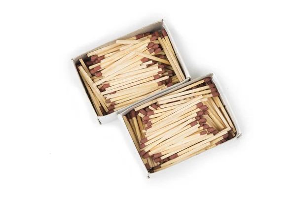 Match sticks with brown heads in stacks .  Matches texture background