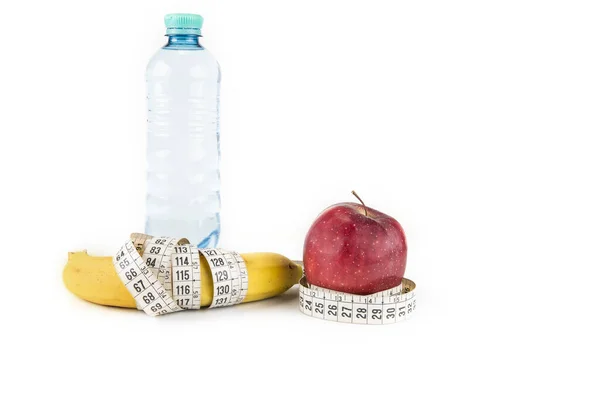 健康饮食 食物和体重减轻的概念 香蕉苹果的密闭和测量带子 — 图库照片