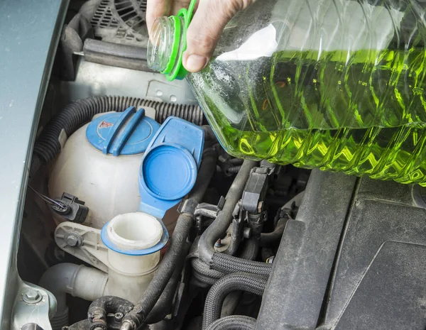 Add up windshield wiper summer fluid in car