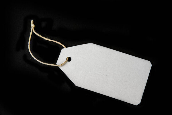 Blank paper label or cloth tag on the black