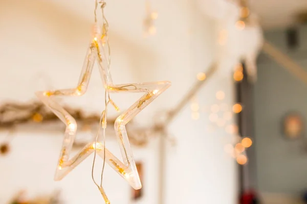 A glowing star with lights. a beautiful decoration for Christmas. New Year decor elements — Stock Photo, Image