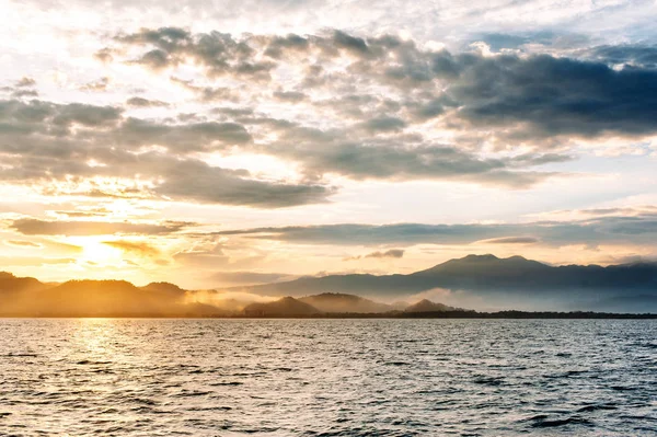 Sunrise near Flores. Islands of Komodo National Park in East Nusa Tenggara, Indonesia. Stock Picture