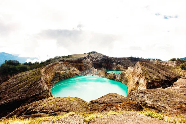 Kelimutu National Park in Indonesia. Colored lakes in Kelimutu volcano crater, Flores. Royalty Free Stock Photos