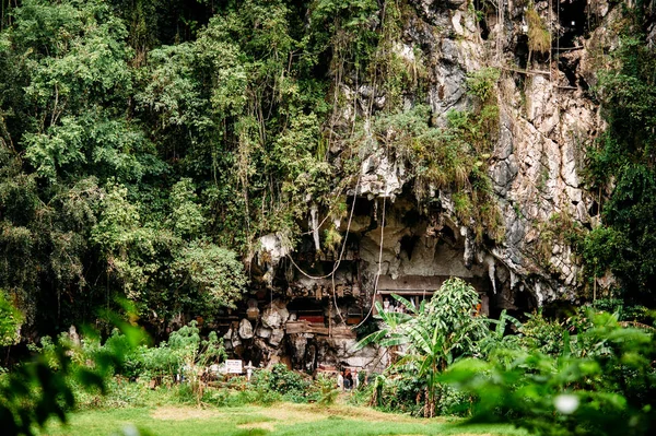 Old torajan burial site in Londa, Tana Toraja. The cemetery with coffins placed in cave.  Rantapao, Sulawesi, Indonesia Royalty Free Stock Photos