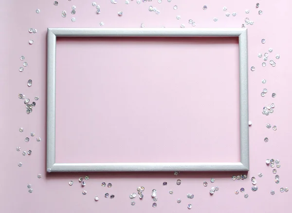 Empty frame silver with the confetti and space for text on pink background. — Stock Photo, Image