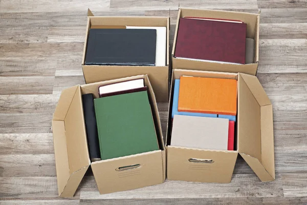 Cardboard boxes full of books — Stock Photo, Image