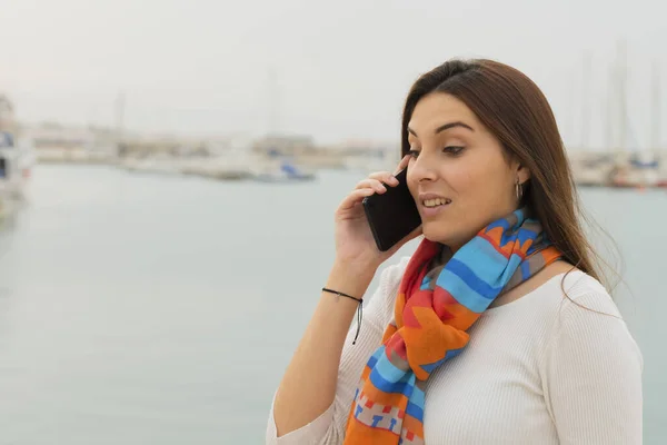 Closeup of a teenager talking on her phone — Stockfoto