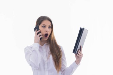 Successful businesswoman looks amazed at a tablet