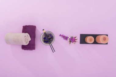 Dry towels with bowl and assorted spa decorations