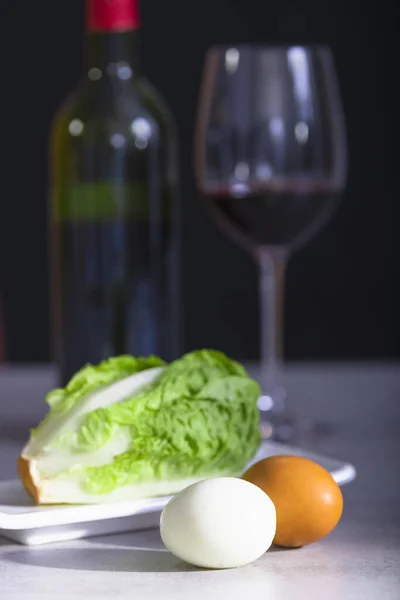 Hard boiled eggs with fresh lettuce and wine — Stok fotoğraf