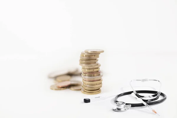 View of piled coin and medical material — Stock Photo, Image