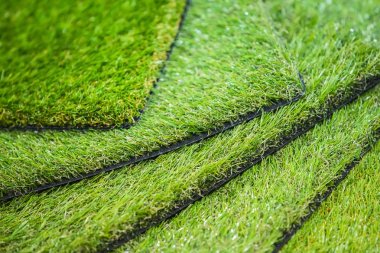 Green artificial turf. Probes examples of artificial turf, floor coverings for playgrounds. clipart