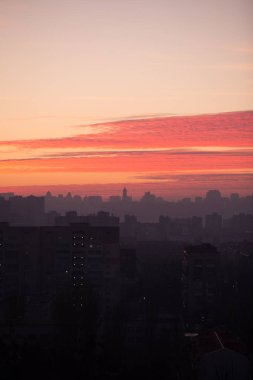 Sunset in Kiev, evening view of the panorama Kiev city. Red clouds in the capital of Ukraine
