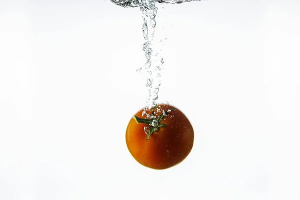 Close View Splashing Water Red Tomato White Background Beautiful Backgrounds — Stock Photo, Image