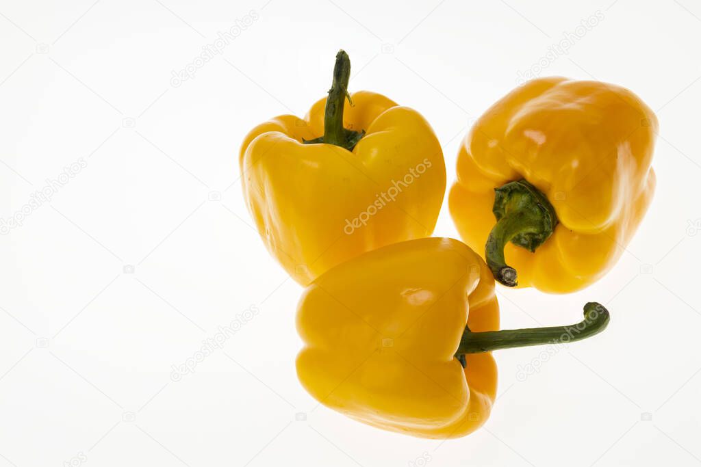 Close up view of fresh yellow paprika isolated on white background. Healthy eating concept. 