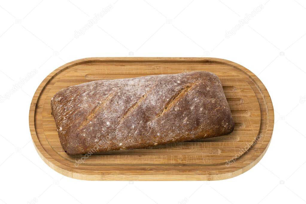 Close up view of rye bread loaf on wooden cutting board with bread. Food and health concept beautiful backgrounds.
